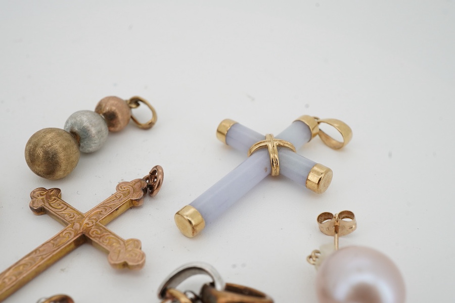 A collection of jewels, comprising: a diamond cross pendant in bicoloured 9ct gold, length 4.5cm, British hallmarks; an early 20th century gold cross pendant with foliate engraving, stamped B&S 9CT; a pale lavender jadei